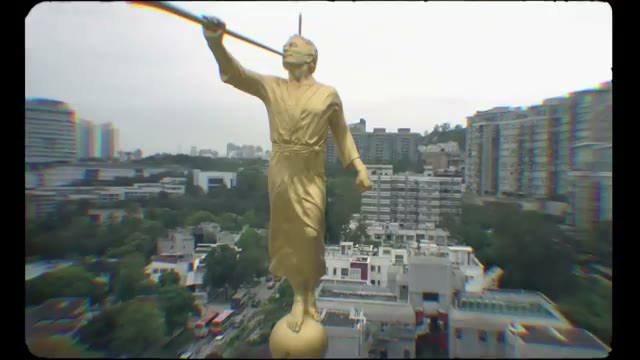 A close-up of the golden statue of the Angel Moroni atop a Mormon temple, a key symbol of the LDS Church.